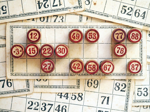Tabletop old lotto game with wooden elements. Cards bingo.