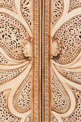 Beautiful brown carved shutters with floral ornament, background