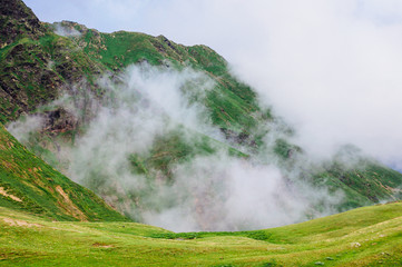 Rocky Caucasus Mountains covered with clouds near Mestia in Svaneti, Georgia