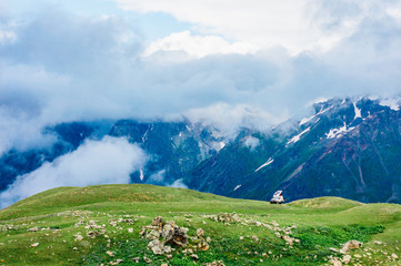 Fototapeta premium Rocky Caucasus Mountains covered with clouds near Mestia in Svaneti, Georgia