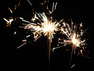 Christmas sparklers in the dark, background for xmas, new year