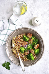 Mix of grains with broccoli and fried meatballs.Top view.