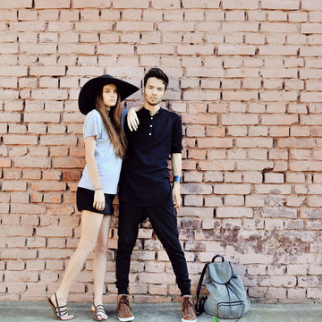 Outdoor fashion portrait of a beautiful young couple