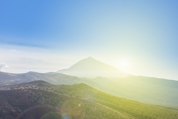 Obraz premium Forest, mountain landscape - blue sky, sun