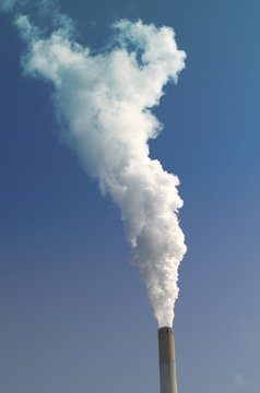 smoke cloud by industrial chimney