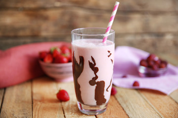 Berry milkshakes on wooden table