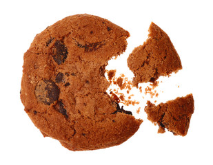 Tasty cookie with chocolate chips and crumbs on white background