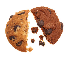 Tasty cookies with chocolate chips and crumbs on white background