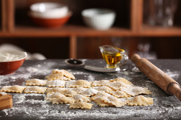Uncooked ravioli on table