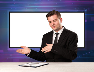 Television program host with big copy screen in his back