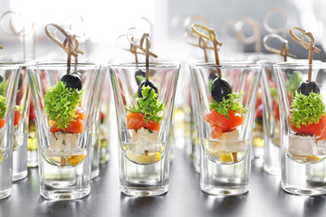 Fresh tasty canapes on table