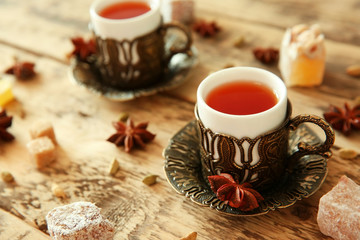 Fresh tea composition on wooden background
