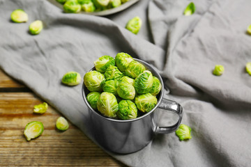 Brussels sprouts in metal mug on napkin