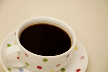 Coffee cup on the wooden table