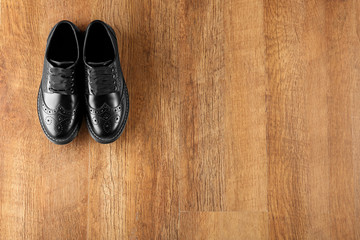 Black shoes on wooden background