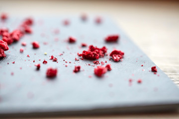 dried raspberries or berries on stone plate