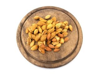 group of almonds on chopping board isolated on white.Almonds iso