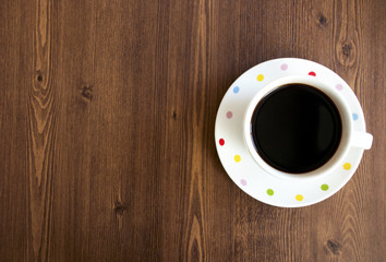 Coffee cup top view on wooden table background
