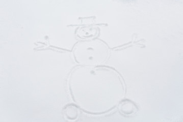 snowman drawing on snow surface