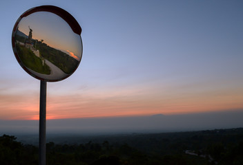 Road Corner Mirror on a beautiful sunset sky