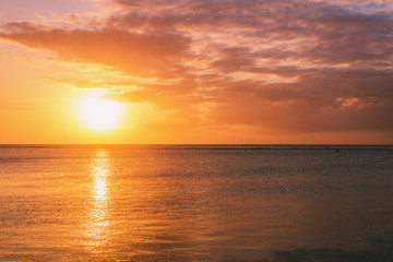 Naklejka na ściany i meble Sunset over the ocean