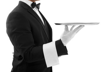 Male waiter holding tray on white background