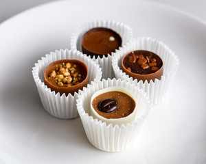 Swiss chocolate pralines on a white plate