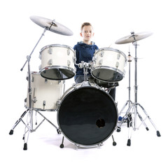 Fototapeta na wymiar teenage boy behind drum kit in studio