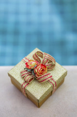 Christmas gift box with swimming pool background, vertical style