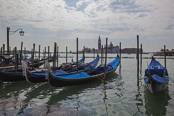 Venetian gondolas anchored in the lagoon