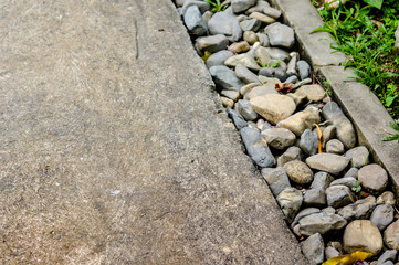 rainwater drainage system walkway build by pebbles in a park