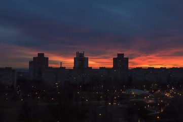 Fototapeta premium Communal buildings with large park in the sunset