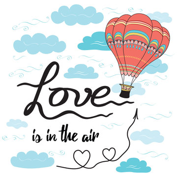 Positive hand drawn slogan Love is in the air decorated hot balloon, hearts, sky, clouds