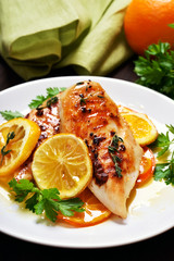 Roasted chicken breast in orange sauce