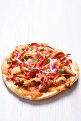 Pizza with chicken meat and red bell pepper