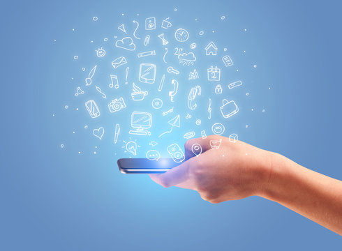 Hand with phone and drawn office icons