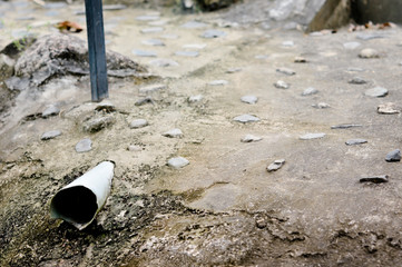 drainpipe in cement ground for waste of water around house