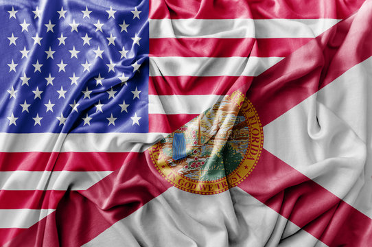 Ruffled waving United States of America and Florida flag