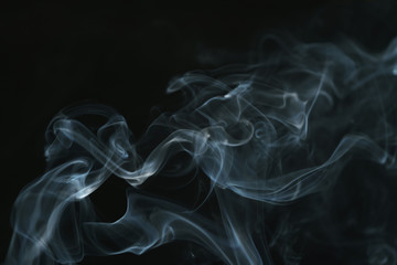 real blue smoke over black background, abstract backdrop