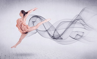Obraz na płótnie Canvas Modern ballet dancer performing with abstract swirl