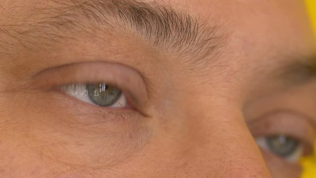man opening his eye: closeup footage
