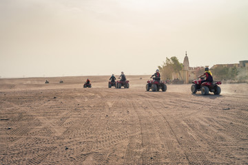 Obraz na płótnie Canvas HURGHADA, EGYPT: Quad bikes safari in the desert near Hurghada, Egypt. Day photos.