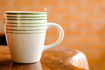 Cup of coffee on a wooden table