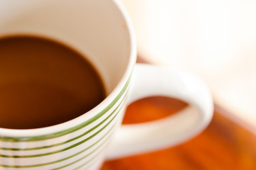 Cup of coffee on a wooden table