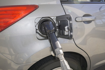 Fossil fuel pumping into vehicle