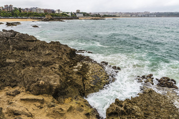 Rocky coastline along cliffs in Santander, Spain