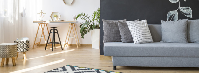 Living room with sofa, chairs and desk