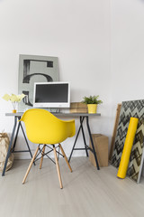Workplace with yellow chair