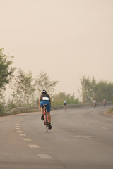Fototapeta premium Asia cyclist road bicycle in triahlon compettion