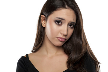 Fototapeta premium sad young woman on a white background